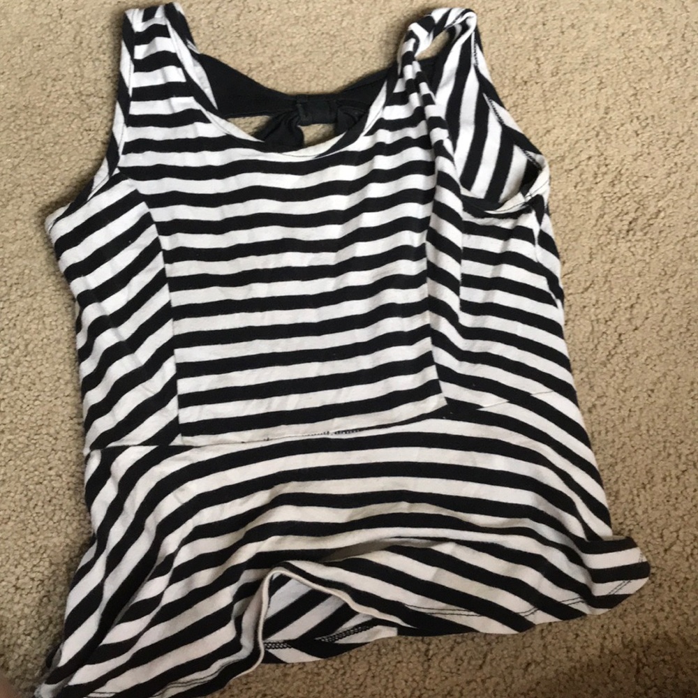 A black and white crop top with bow in the back